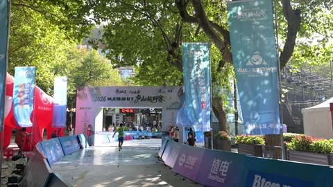 Back View of Male Runner Approaching Finish Arch, Lushan Race Stock Footage 346719277