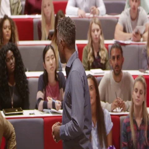 Back view of male teacher lecturing university students, shot on R3D Stock Footage 69411113