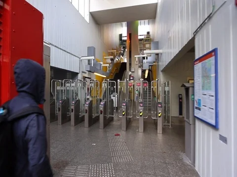Back view on Man with a backpack passes through the turnstiles in the subway Stock Footage 83223683