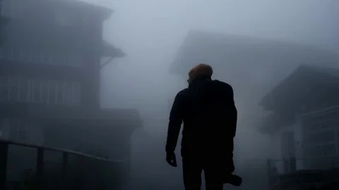 Back view of a man with backpack in a thick fog. Stock Footage 201165058