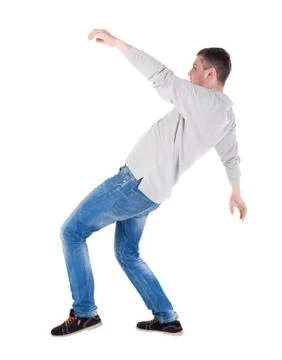 Back view man Balances waving his arms Stock Photos
