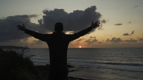 Back view Man Black silhouette standing with sweatshirt and hood looking at Stock Footage 119358392