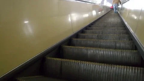 Back view of man is climbing an escalator in the subway. 스톡 동영상 98217076