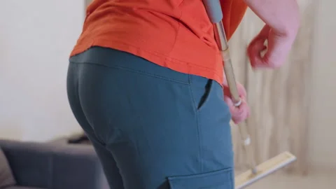 Back View Of Man Dancing With Mop Like Guitar While Cleaning Stock Footage 319916263