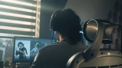 Back view of man developing video game Stock Footage 211796614