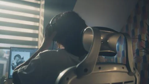 Back view of man developing video game Stock Photos