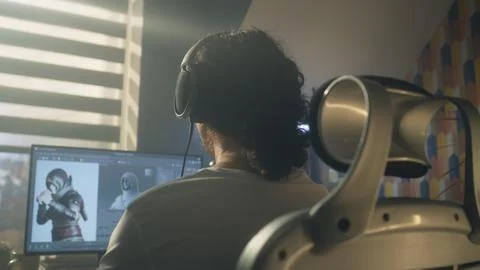 Back view of man developing video game Stock Photos