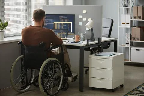 Back View Man with Disability as Programmer Writing Code in Office Stock Photos