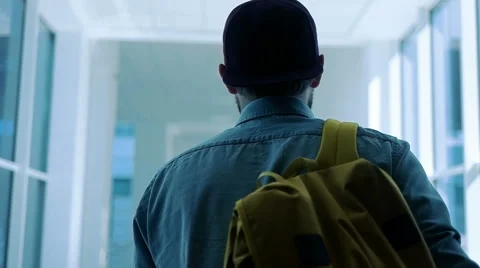 Back view of man going along hallway Stock Footage 67644818