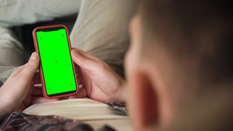 Back View of man of Green Mock-up Screen Smartphone. Chroma Key Stock Footage 207781276