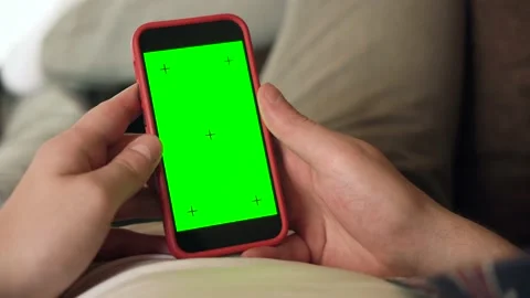 Back View of man of Green Mock-up Screen Smartphone. Chroma Key Stock Footage 211812553