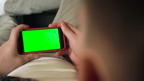 Back View of man of Green Mock-up Screen Smartphone. Chroma Key Stock Footage 212609551