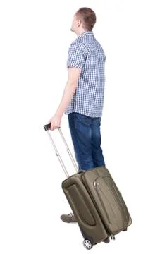 Back view of man with  green suitcase looking up Stock Photos