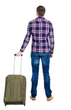 Back view of man with  green suitcase looking up Foto stock