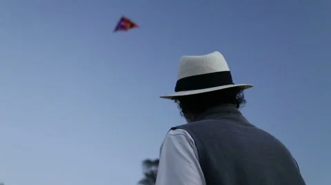 Back view of man with hat kiting at beach in Goa. Stock Footage 49667561
