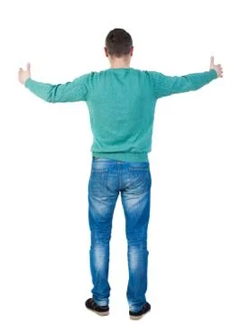 Back view of man in jeans. Standing young guy Stock Photos
