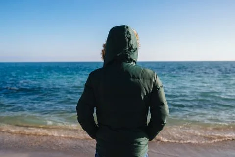 Back view of man looking at the sea. Stock Photos