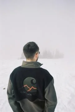 Back View of a Man Looking at the Snow Stock Photos