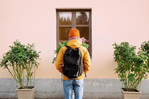 Back View Of Man Person With Backpack Facing Window Stock Photos