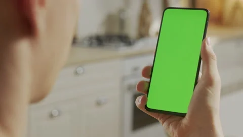 Back View of Man at Phone with Green Screen for Copy Space. Chromakey Mock Up Stock Footage 205572355