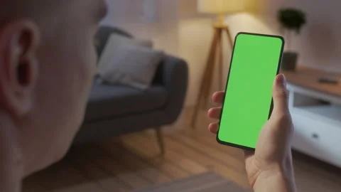 Back View of Man at Phone with Green Screen for Copy Space. Chromakey Mock Up Stock Footage 205574091