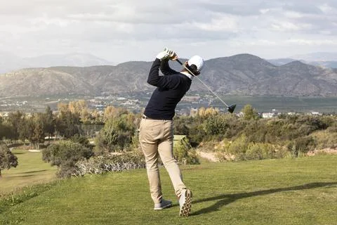Back view man playing golf field Resolution and high quality beautiful photo Stock Photos