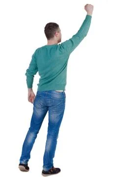 Back view of  man. Raised his fist up in victory sign.   Rear vi Foto stock