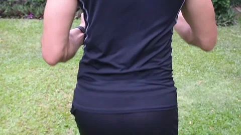 Back view of man running in slow motion - close up Video stock 130708642