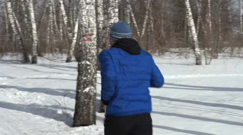 Back view of man is running through the forest Video stock 53313859