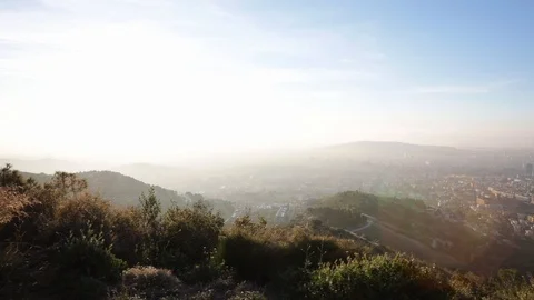 Back view of a man taking pictures at sunrise Stock Footage 104123619