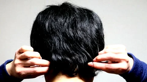 The back view of a man touching his long hair. Stock Footage 336186648