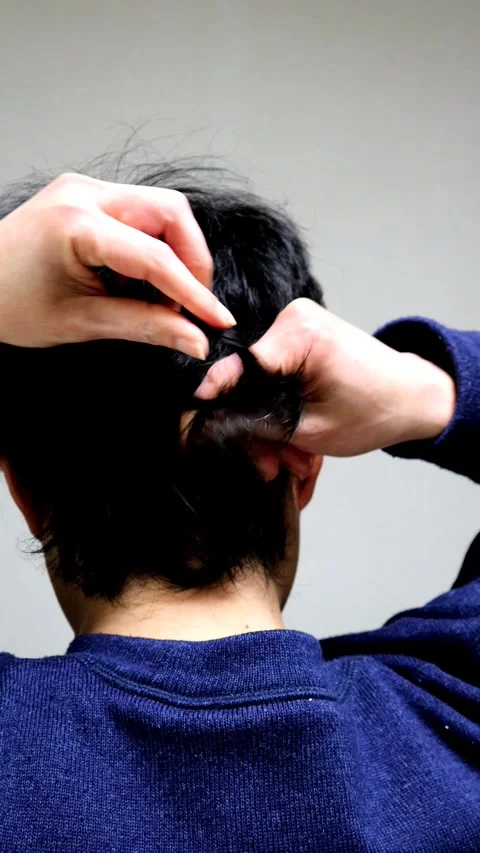 The back view of a man touching his hair. Stock Footage 336232631