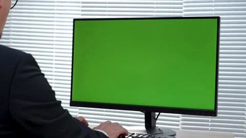 Back view of man using computer with green screen at office. Close-up of bu.. Stock Footage 288855723