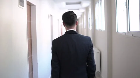 Back View Man Walking Alone In Hotel Stock Footage 130022521