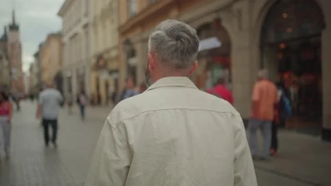 Back view of the man walking in busy Flo... | Stock Video | Pond5