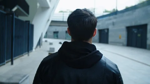 Back view of man walking on urban street. Man going on city street. Vidéo 121145570