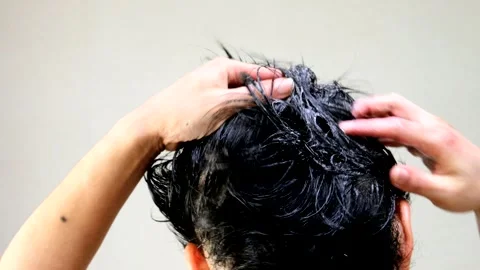 The back view of a man washing his hair Stock Footage 336007394