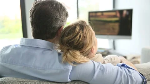 Back view of mature couple watching tv Stock-Footage 48753724
