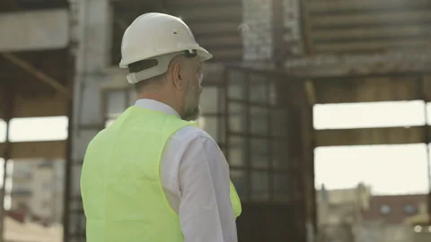 Back view of mature man wearing hardhat at working area Stock Footage 201884060