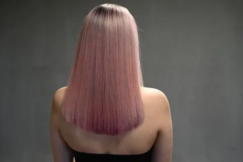 Back view of model with dyed hair on gray background Stock-Fotos