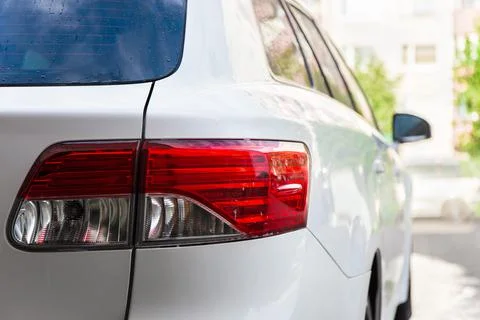 Back view of modern white car on the road Stock Photos
