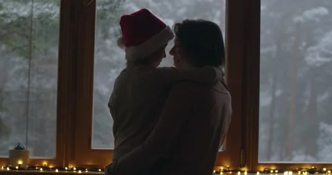 Back view of mom hugging son with care love indoors cozy atmosphere slow motion Stock Footage 147126106