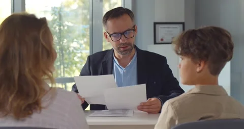 Back view of mother and son having interview with school headmaster Stock Footage 159824016