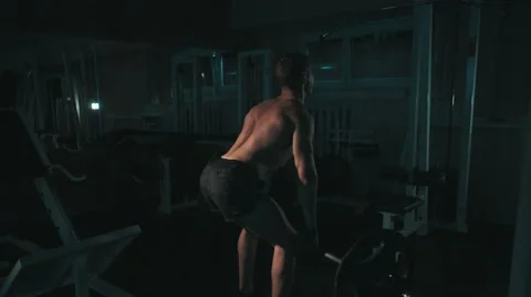 Back view of muscular man doing exercising with barbells at gym 스톡 동영상 68414778