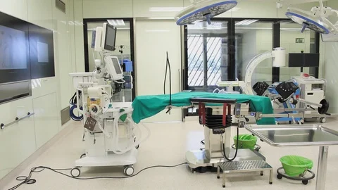  Back view of nurse checking equipment in modular operating theatre. 스톡 동영상 129896748