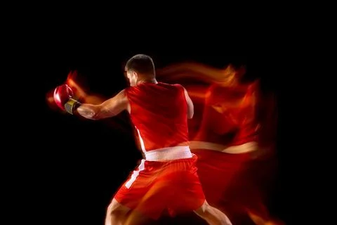 Back view. One professional boxer in red shorts and gloves training, exercising Stock-Fotos