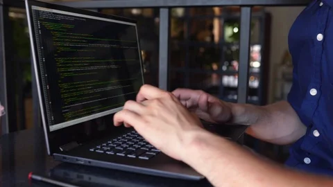 Back view over the shoulder shot of developer programmer with laptop. Program Stock Footage 122766647