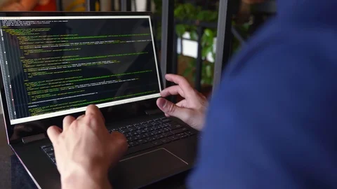 Back view over the shoulder shot of developer programmer with laptop. Program Stock Footage 122766683
