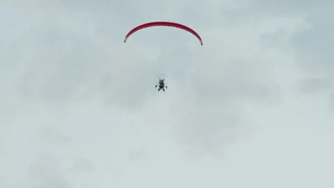 Back view of paraglider pilot soaring into sky Stock Footage 317167447