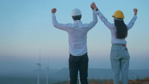 Back view of people engineer are standing in a field  wearing a protective he Stock Footage 149048938